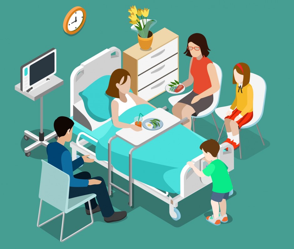 patient in a hospital bed surrounded by family